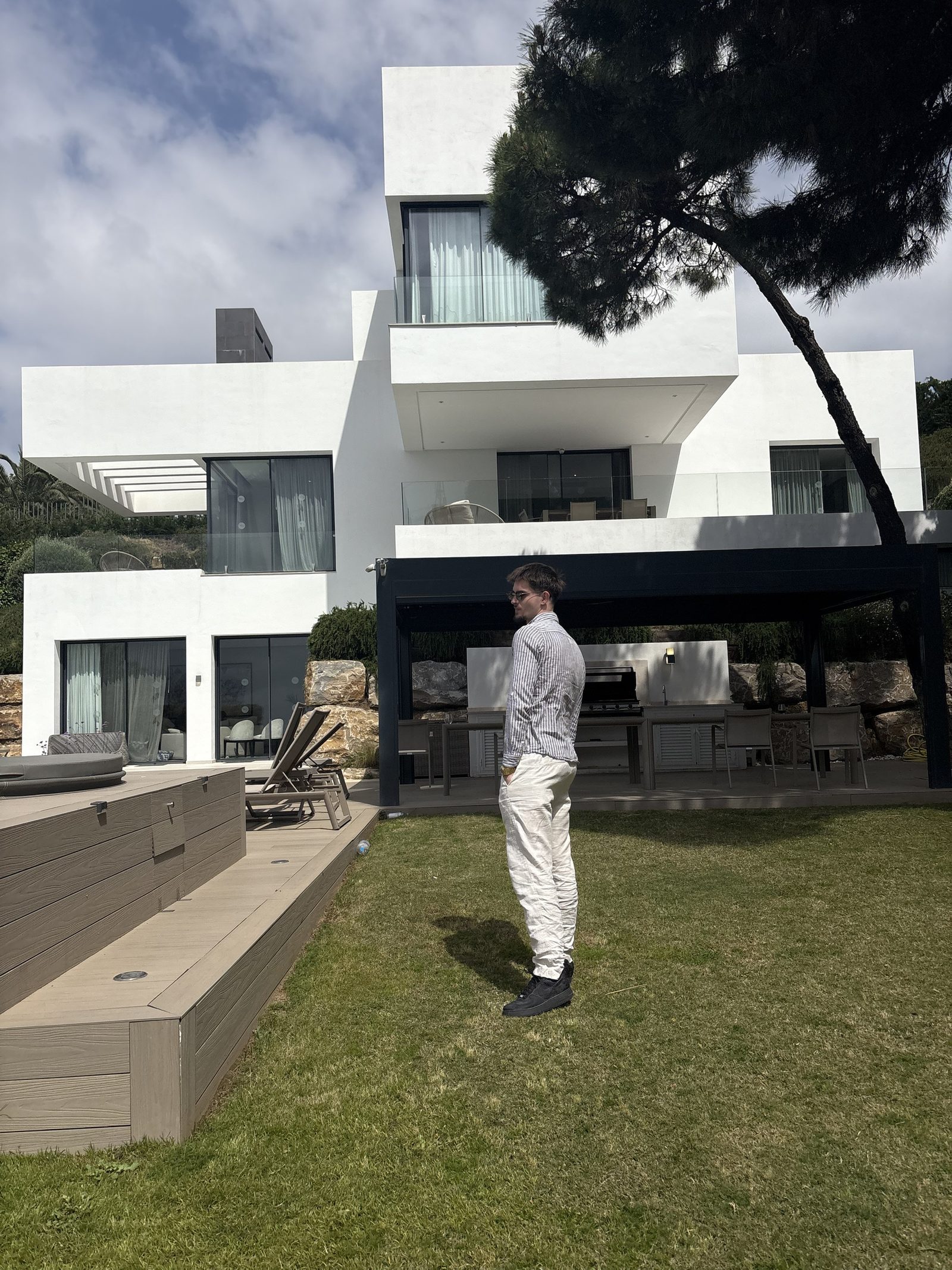 Aron in front of a villa