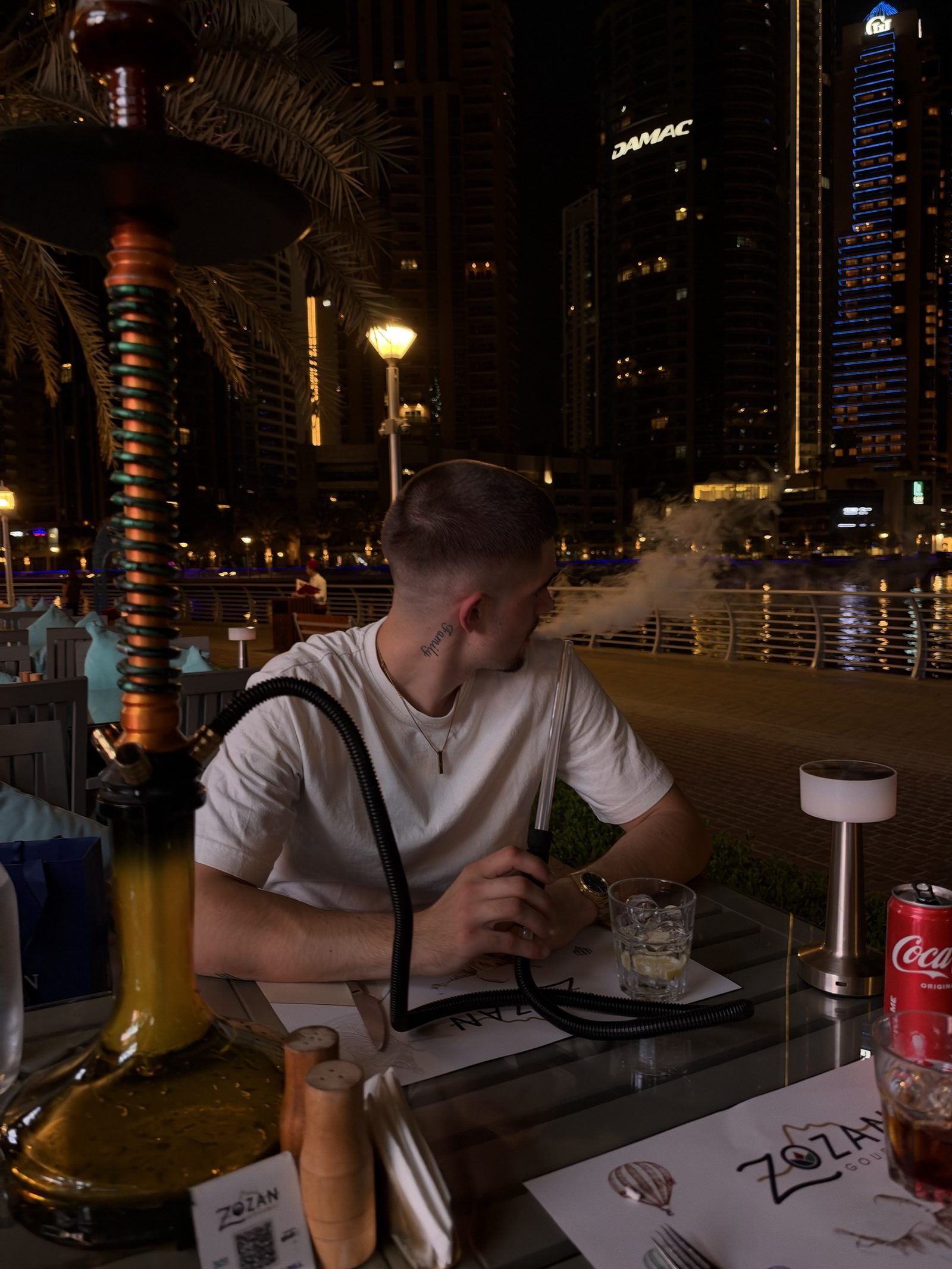 Aron by the marina in Dubai at night